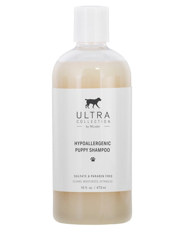 A bottle of Ultra Collection hypoallergenic puppy shampoo in a 16 fluid ounce size.