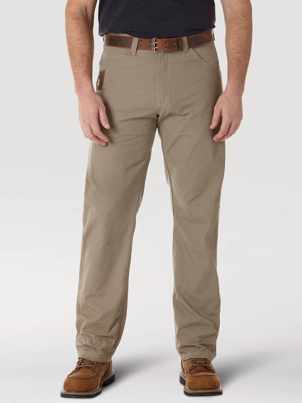 Wrangler RIGGS Workwear Technician pants in Dark Khaki, front view on a model.