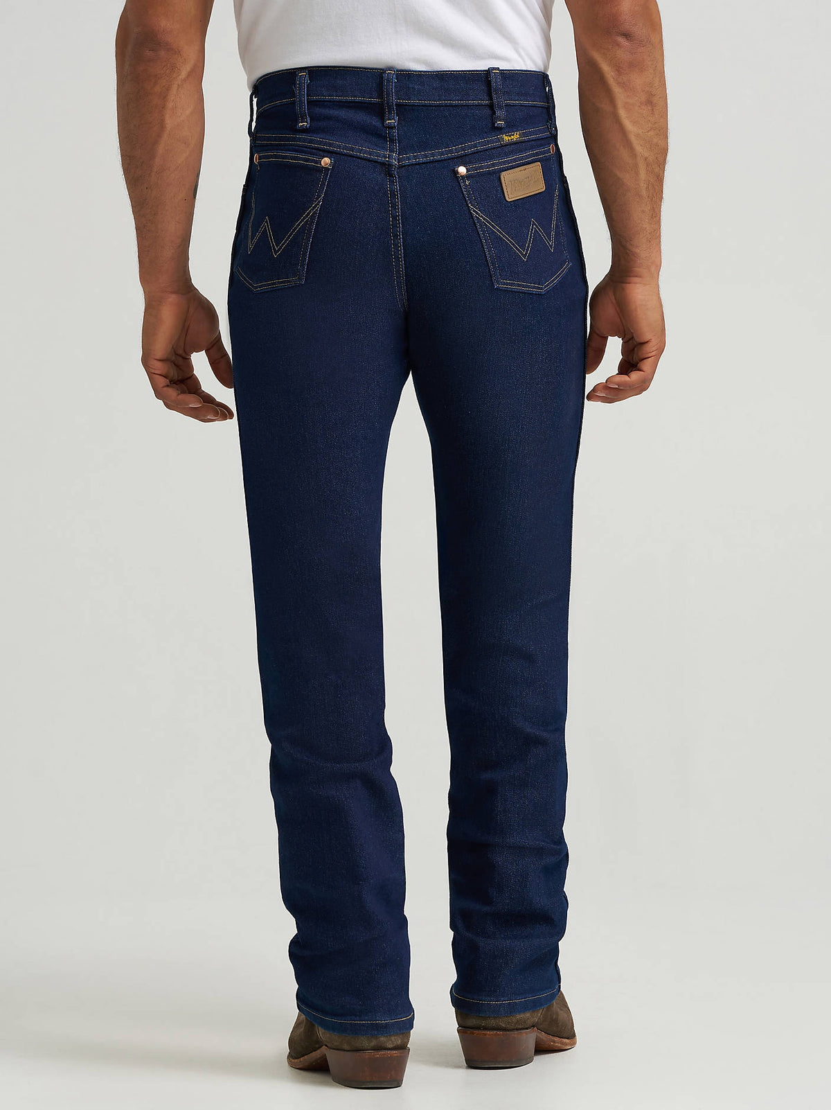 Back view of Wrangler 13MAFPW Active Flex jeans in Prewashed Indigo, showing both rear pockets.