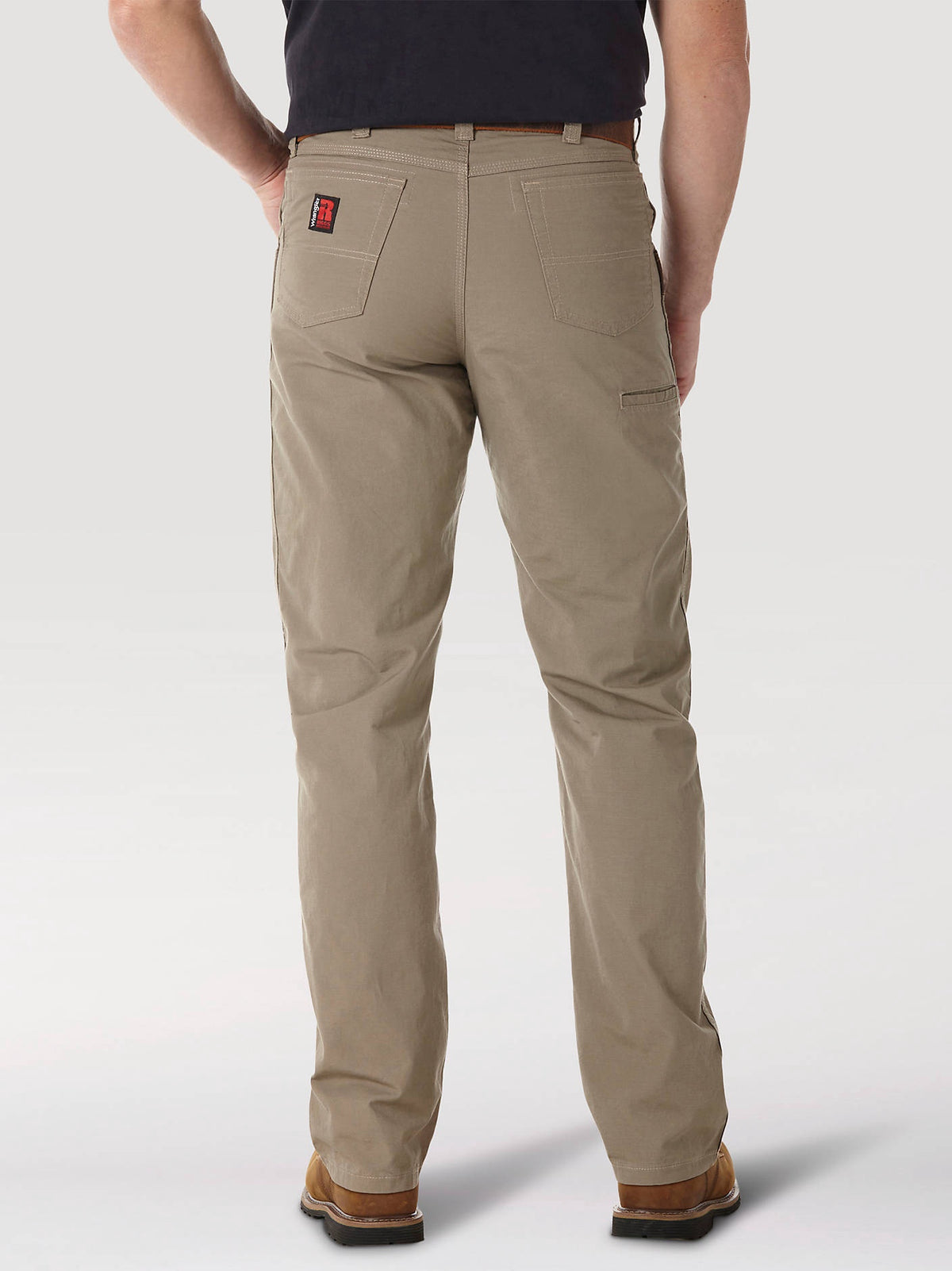 Back view of Wrangler RIGGS Technician pants in Dark Khaki, showing the rear pockets.