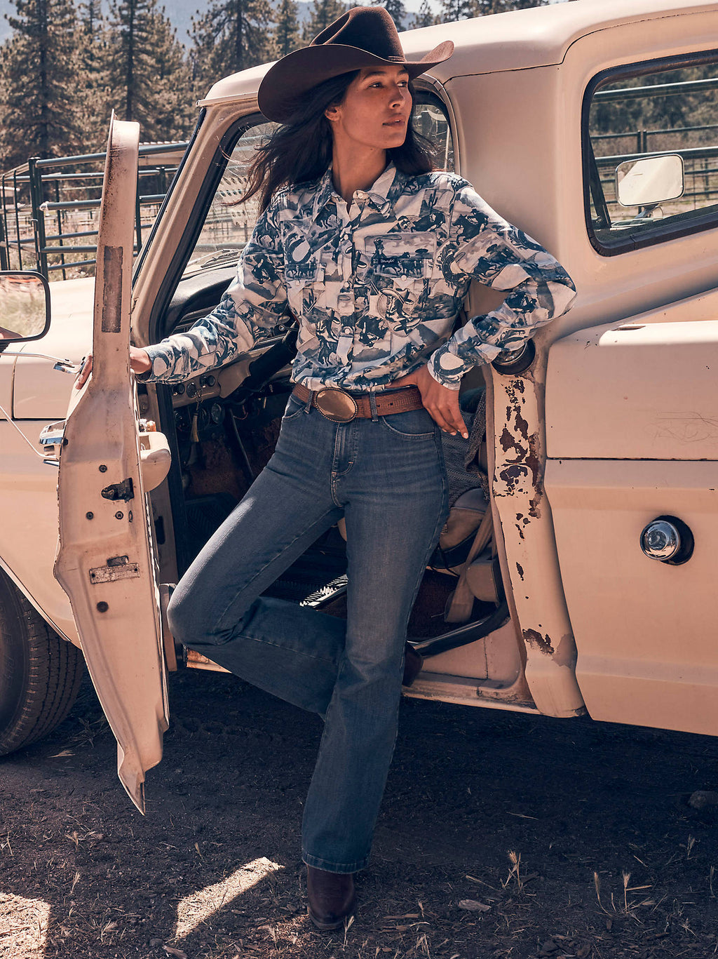 Wrangler Women's Bespoke High-Rise Flare Jeans in Lily, outdoor view beside a truck