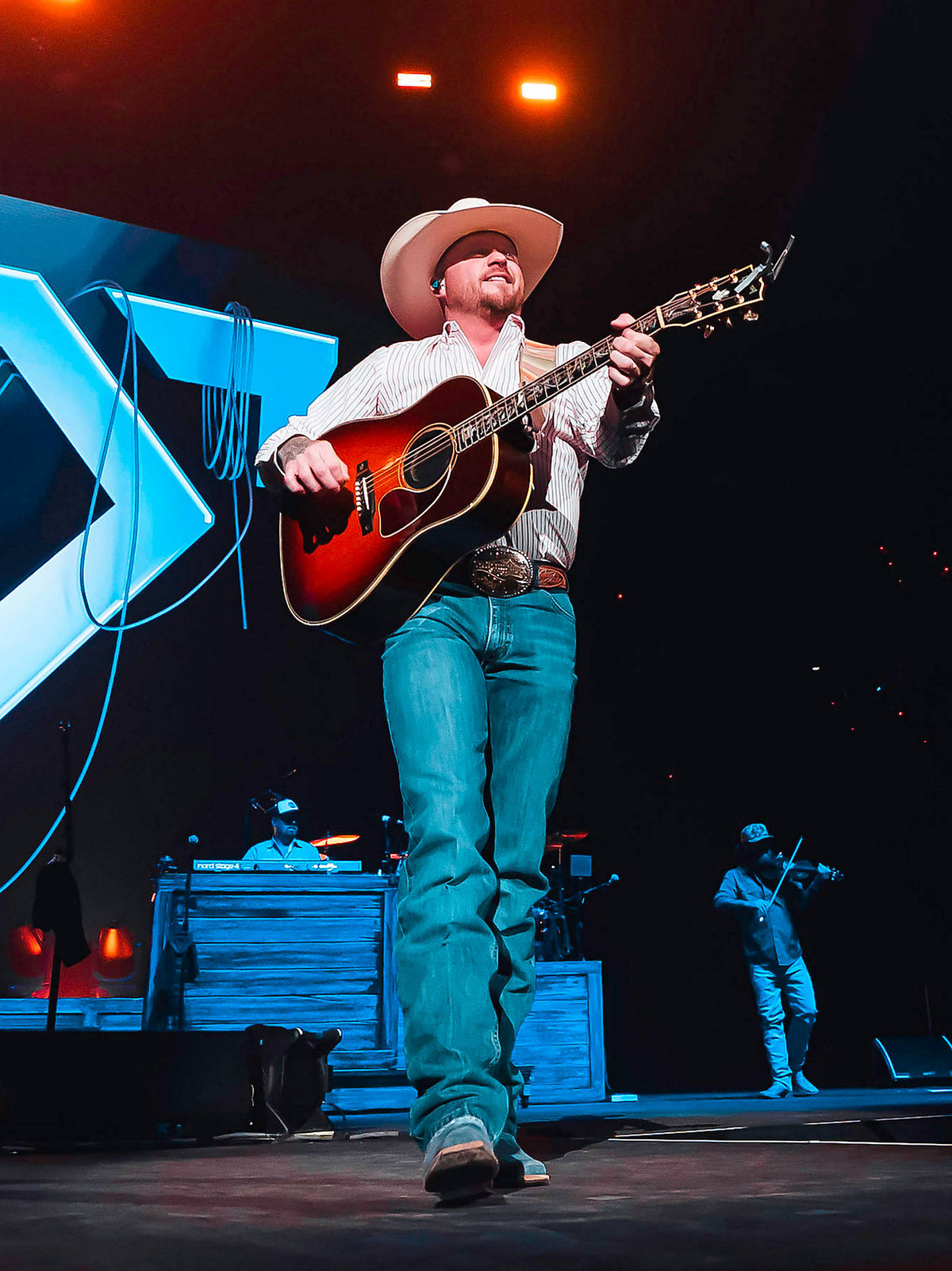 Wrangler Men's Cody Johnson Relaxed Fit Jeans in Blue Stone, performance view on stage