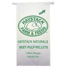 A white bag of Haystack Farm and Feeds beet pulp pellets with green text and logo.
