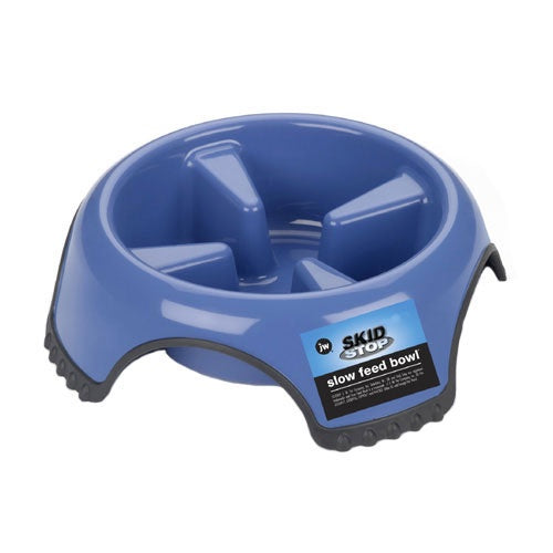 A blue plastic slow feed dog bowl with interior dividers and a non-slip rubber base.