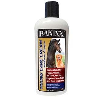 An 8 oz bottle of Banixx wound care cream featuring images of a horse and a dog on the label.