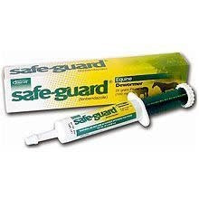 A tube of Safeguard equine dewormer paste sits in front of its yellow and white product box.