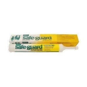 A tube of Safeguard 10% dewormer paste for cattle sits in front of its yellow packaging box.