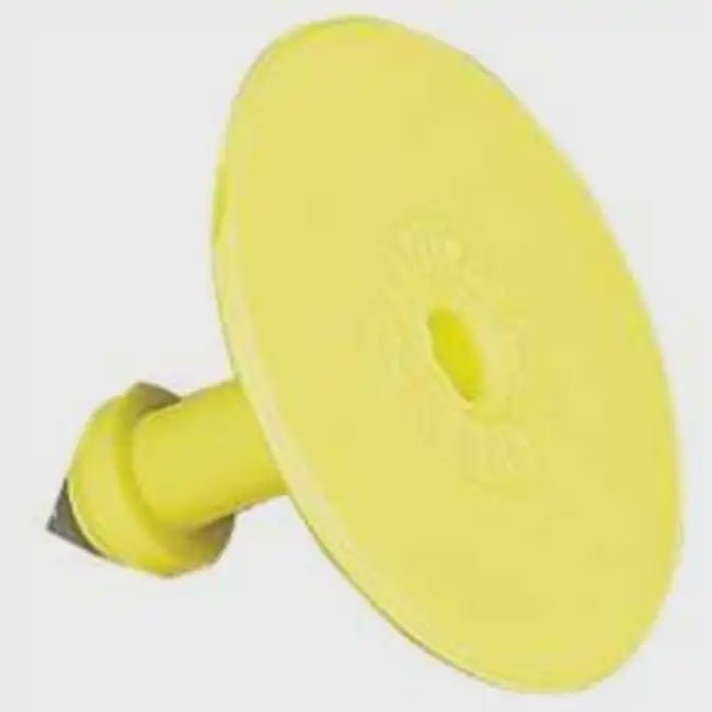 A yellow plastic button tag for the Allflex livestock identification system.