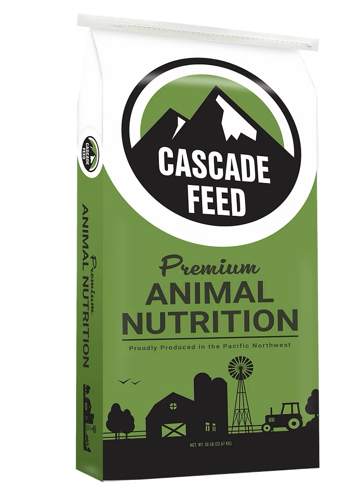 A fifty pound bag of Cascade Feed cracked corn, milled in Harrisburg, Oregon, in Cascade's green Premium Animal Nutrition bag.
