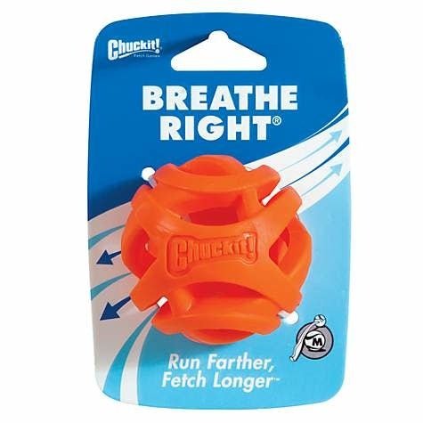 An orange Chuckit! Breathe Right medium fetch ball in its original packaging.