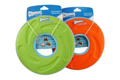 Two medium-sized Chuckit! Zipflight flying discs in green and orange on display cards.