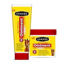 A tube and a tub of Corona Multi-Purpose Ointment featuring yellow labels with red accents.