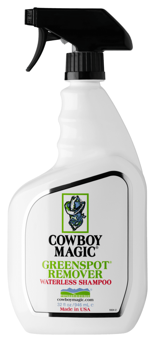 A white spray bottle of Cowboy Magic Green Spot Remover with a black trigger nozzle.