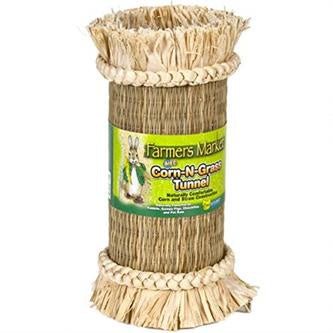 A cylindrical small pet tunnel made of woven corn leaf and straw with braided decorative ends.