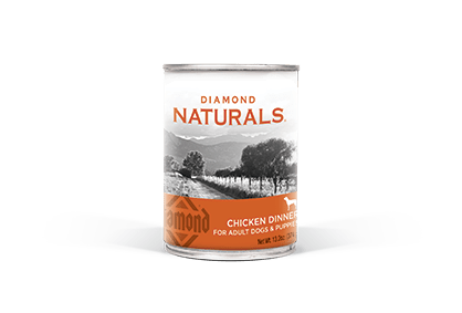 A can of Diamond Naturals Chicken Dinner dog food featuring a landscape image on the label.