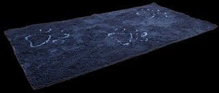 A rectangular dark blue absorbent doormat featuring three light-colored paw print designs.