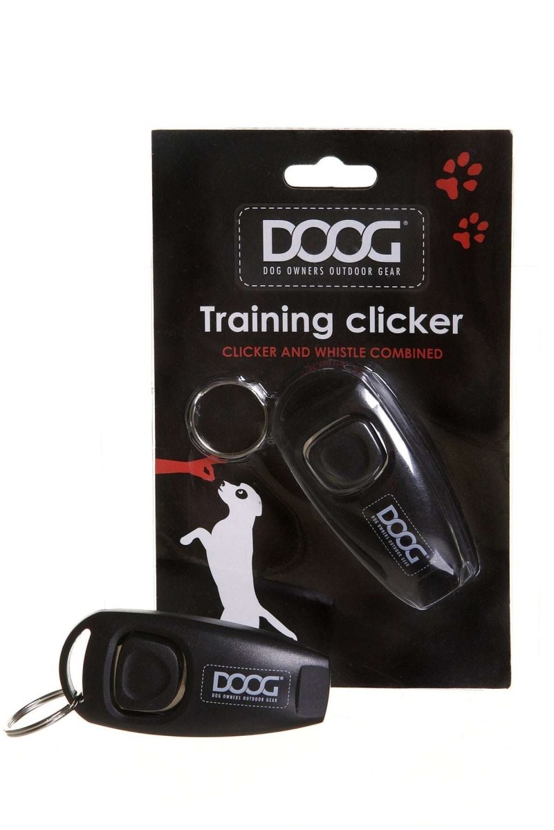 A black Doog training clicker with a built-in whistle, shown in its retail packaging.
