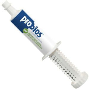 A white oral gel syringe for ruminants labeled Probios with a dosage scale on the plunger.
