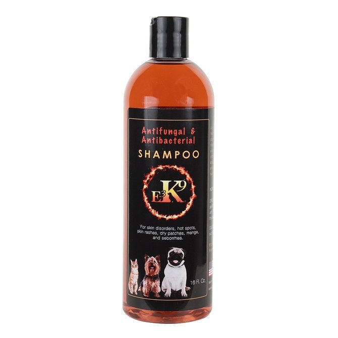 A sixteen-ounce bottle of E3 K9 antifungal and antibacterial shampoo for pets.