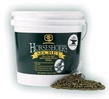 A white plastic bucket of Farnam Horseshoer's Secret pelleted hoof supplement with a small scoop.