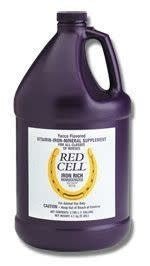 A large purple plastic jug of Farnam Red Cell iron-rich liquid supplement for horses.