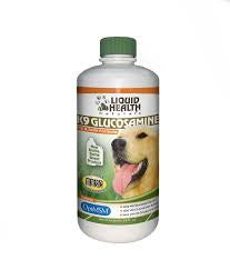 A bottle of Liquid Health K9 Glucosamine joint supplement for dogs with a green cap.