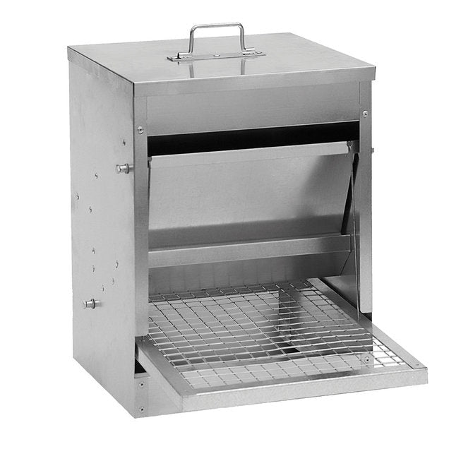 A galvanized steel treadle feeder with a step-on panel and a protective lid.