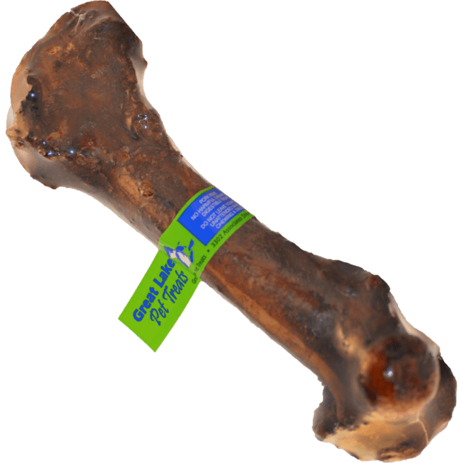 A smoked pork femur bone for dogs with a Great Lakes Pet Treats label attached.