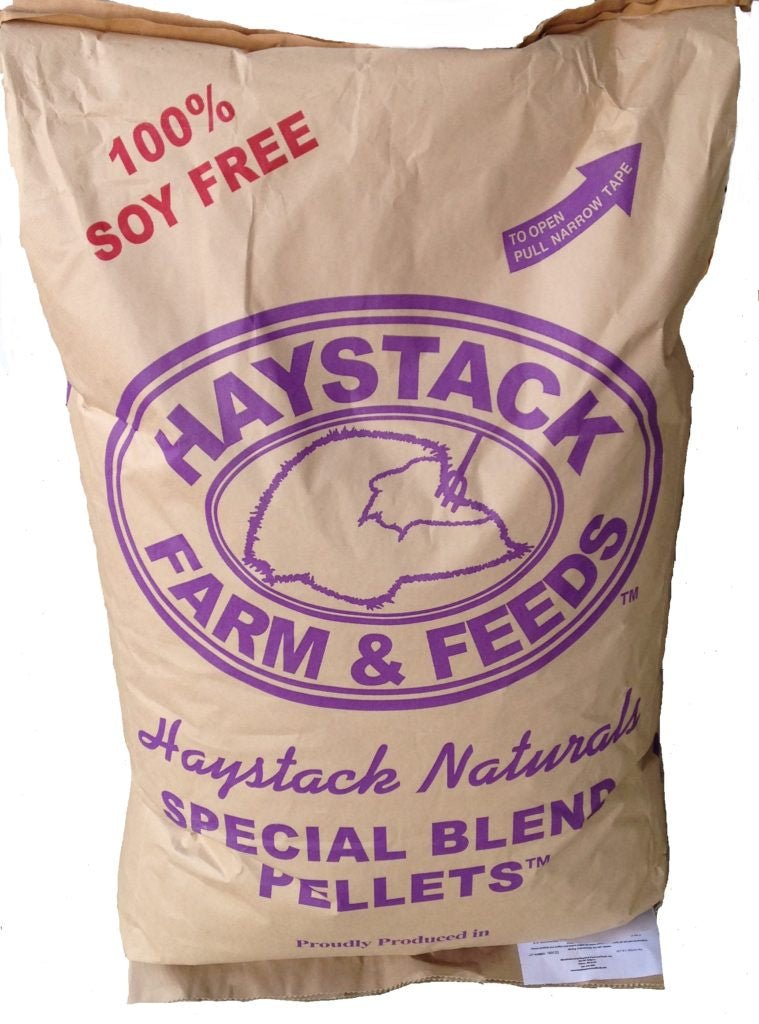 A brown paper bag of Haystack Special Blend horse feed pellets with purple branding.