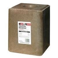 A brown, rectangular American Stockman iodized salt block for livestock.