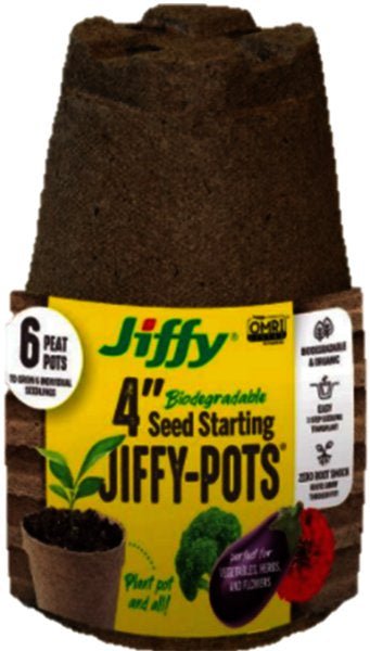 A stack of six brown, biodegradable four-inch Jiffy peat pots for starting seedlings.