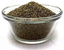 A clear glass bowl filled with organic dried kelp meal granules.