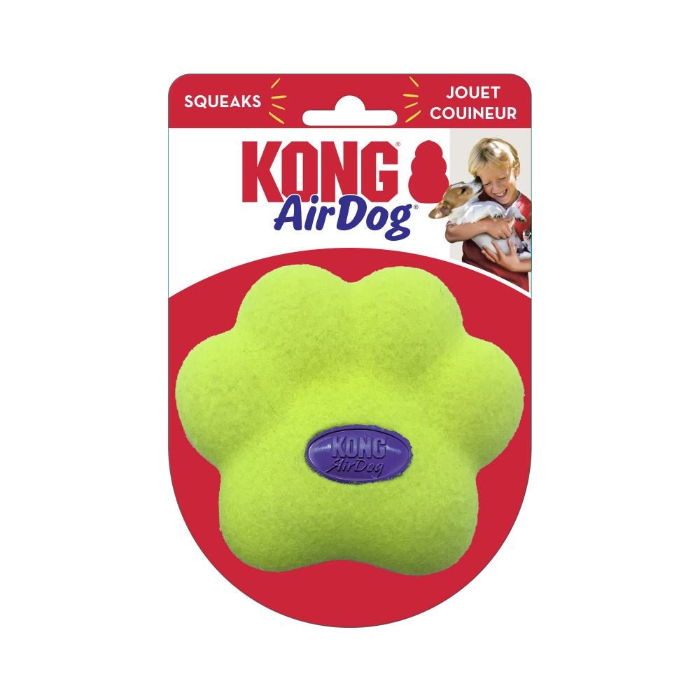 A bright green, paw-shaped Kong AirDog squeaker toy in its retail packaging.