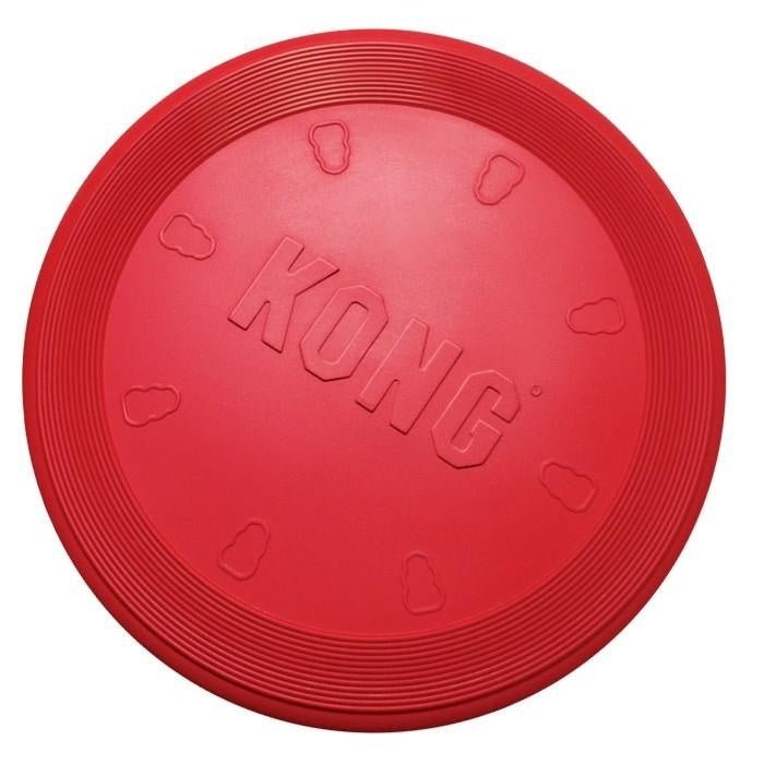 A red, circular rubber dog toy with the word KONG embossed in the center.