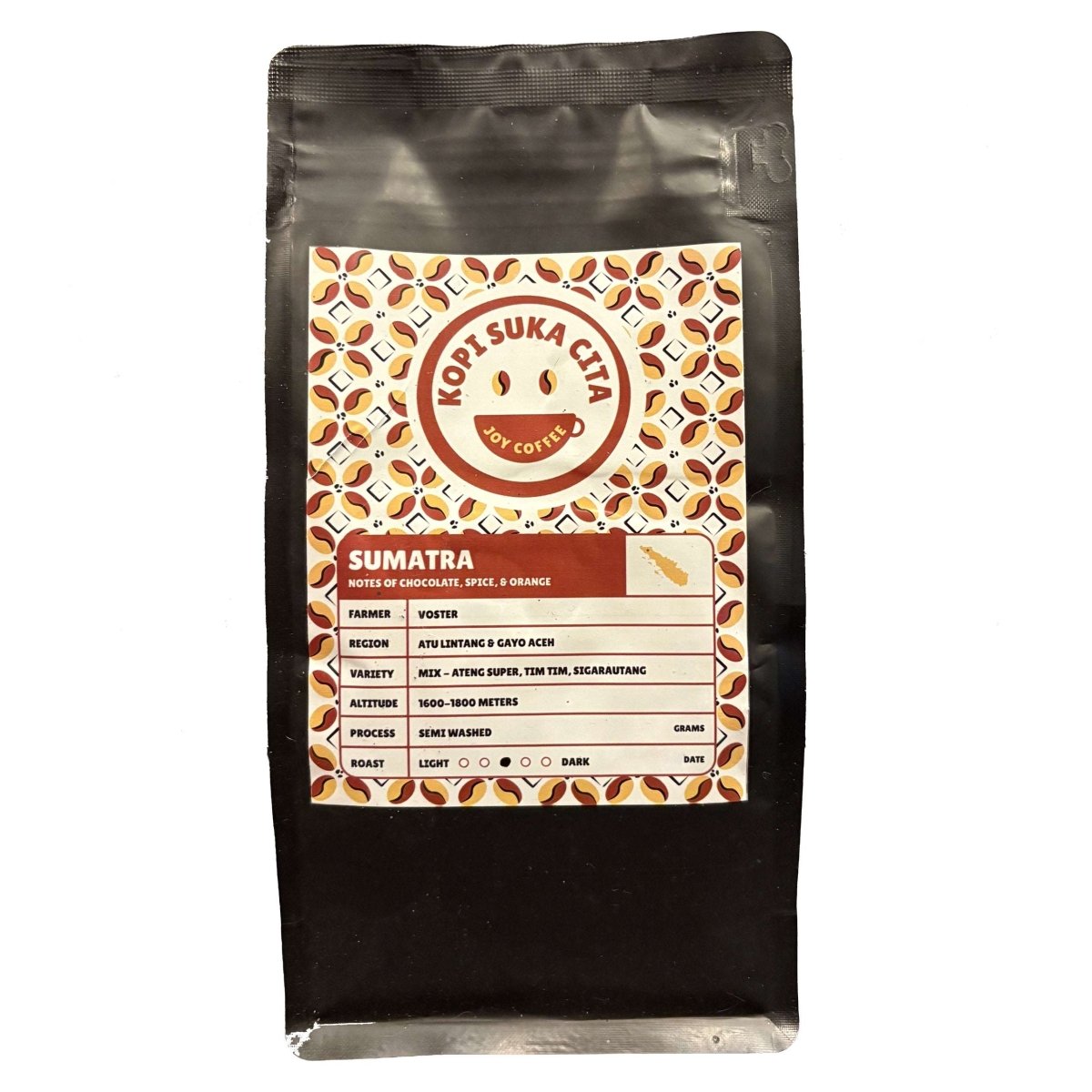 A bag of Kopi Suka Cita whole bean Sumatran coffee with a label detailing its origin and roast.