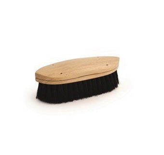 A curved hardwood brush with black bristles for grooming horses.