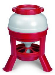 A red and white plastic poultry feeder with a top-fill lid and three elevated legs.