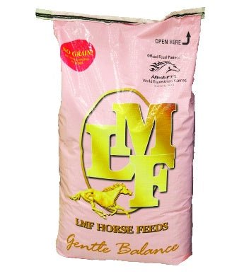 A pink bag of LMF Gentle Balance horse feed with a gold logo and a horse illustration.