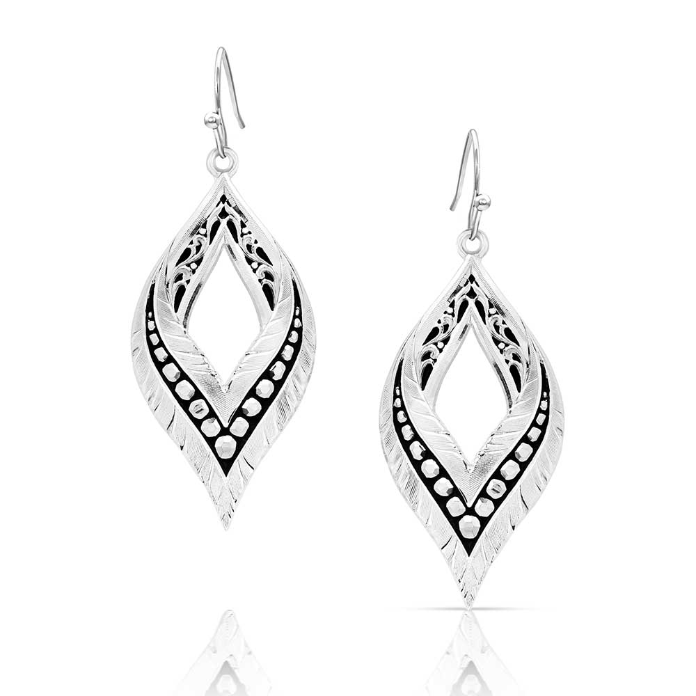 Silver-tone teardrop earrings featuring feather textures, black filigree, and French wire hooks.
