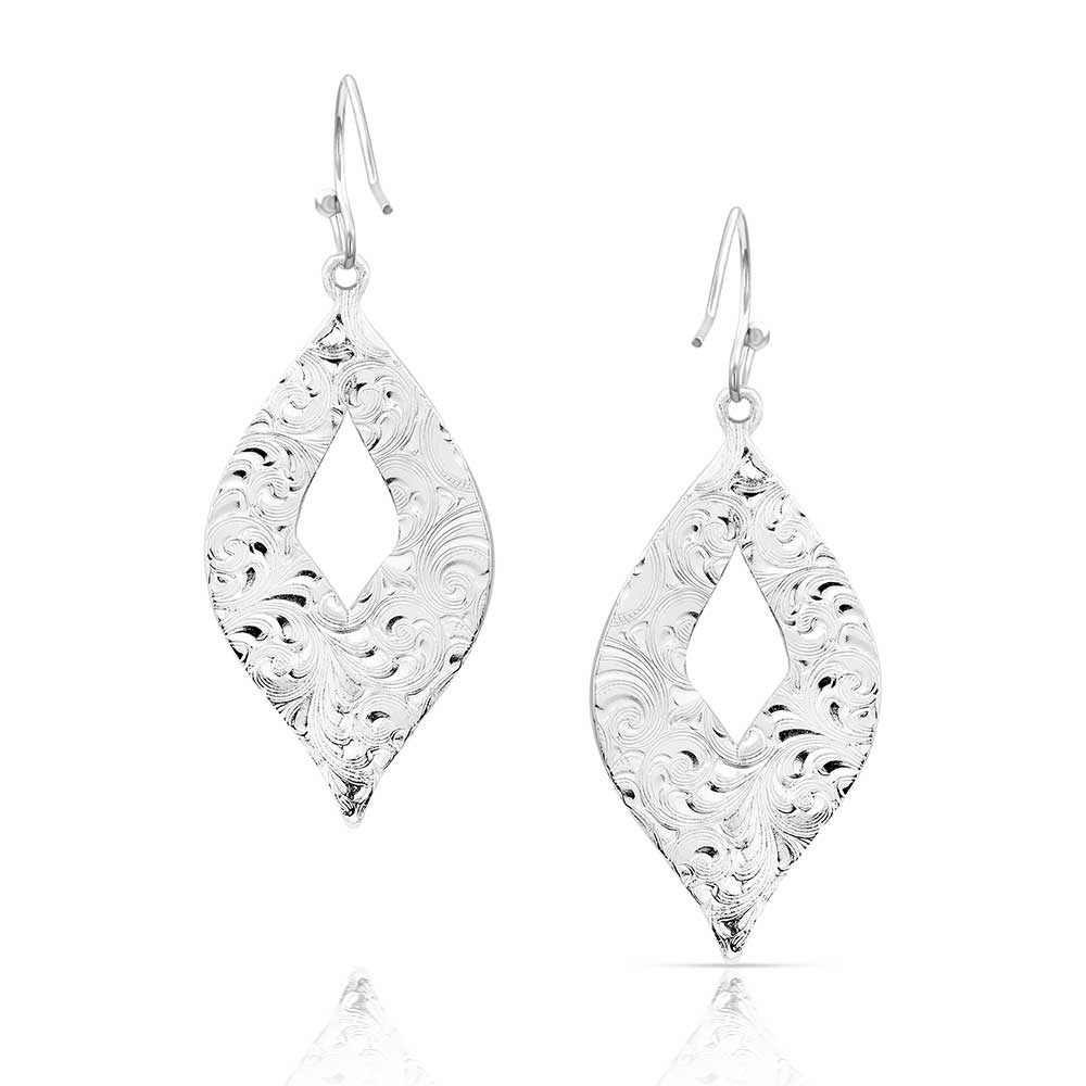 Silver-toned earrings featuring a pointed teardrop shape with intricate filigree patterns.