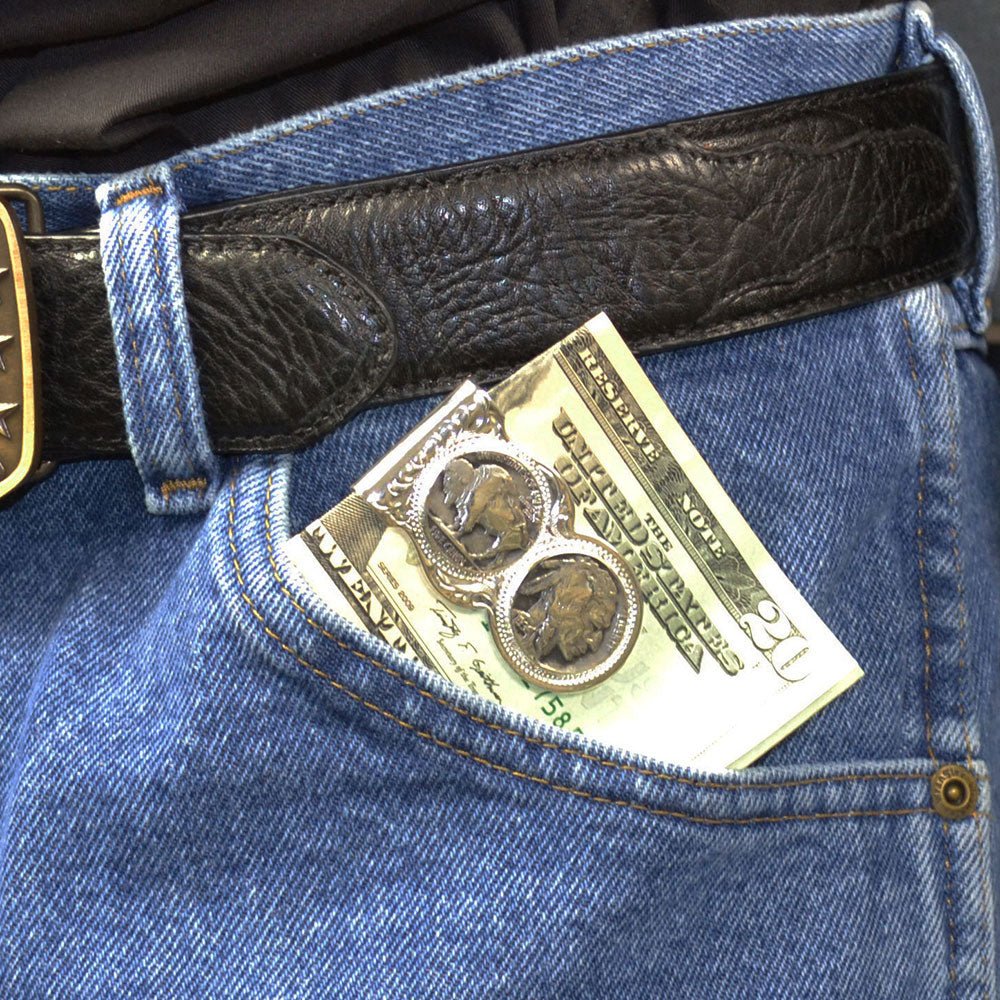 A silver money clip featuring engraved filigree and two replica buffalo nickel coins.