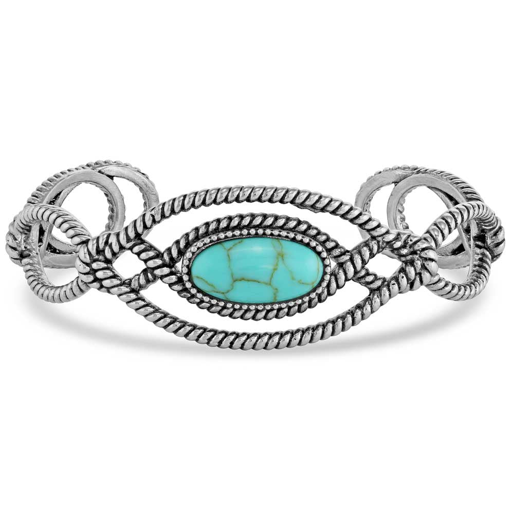 A silver-tone cuff bracelet featuring a central oval turquoise stone and a twisted rope design.