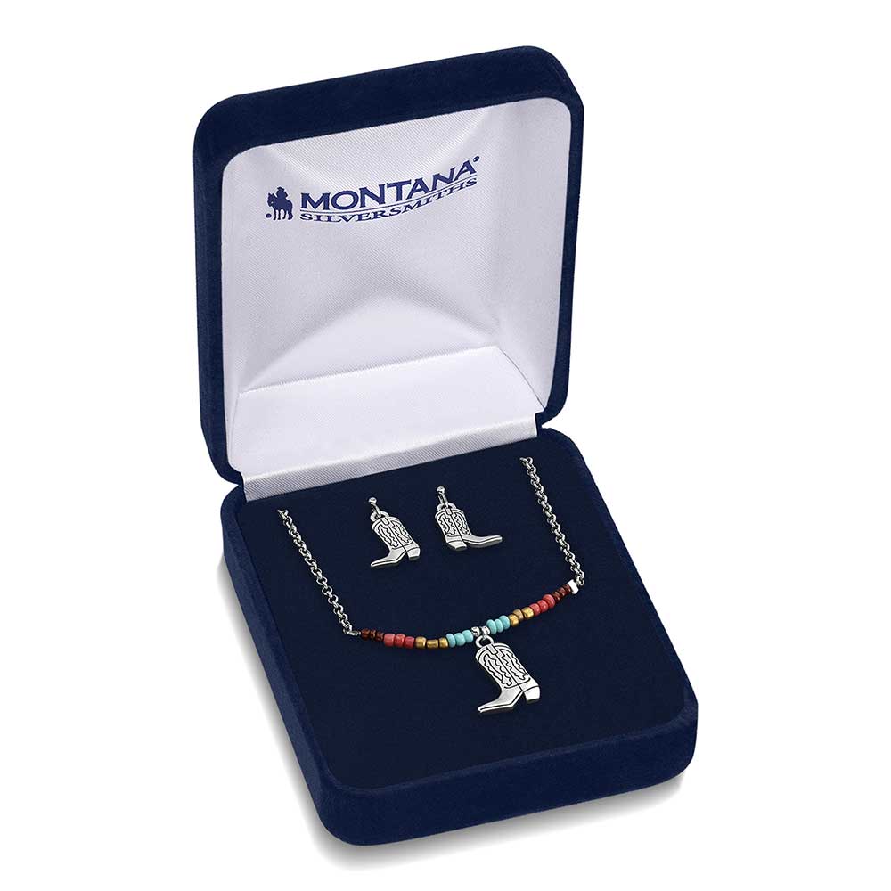 A Montana Silversmiths jewelry set featuring a beaded cowboy boot necklace and matching earrings.