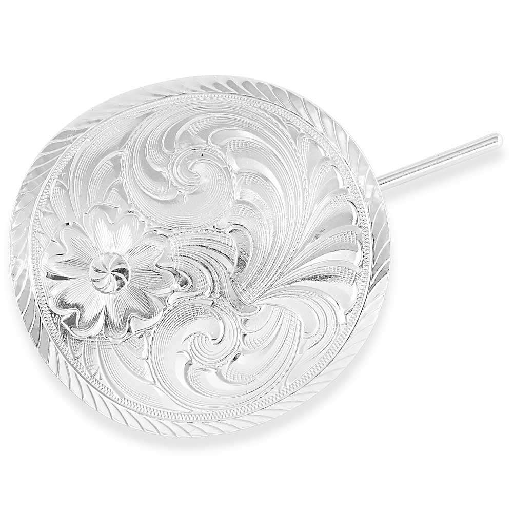 A round silver hair pin featuring intricate western-style floral engraving and a ponytail hook.