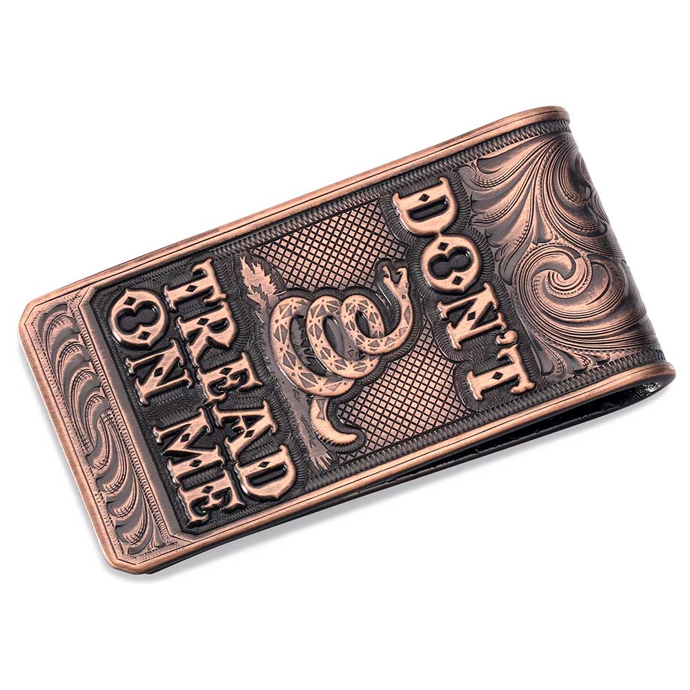 A vintage bronze money clip featuring an engraved Gadsden snake and the text Don't Tread On Me.