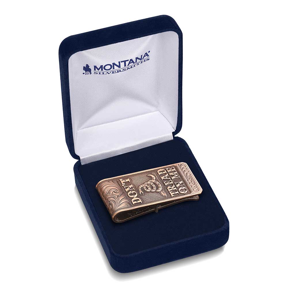 A vintage bronze money clip featuring a Gadsden snake and the phrase Don't Tread On Me.