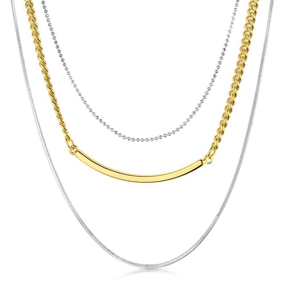 A layered necklace featuring a silver bead chain, a gold link chain with a bar, and a silver chain.