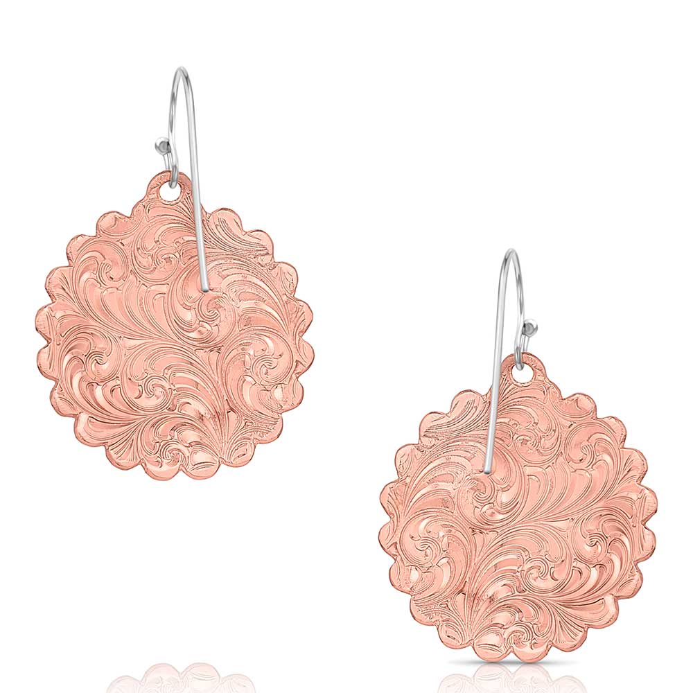 Rose gold tone circular earrings featuring intricate floral engraving and scalloped edges.