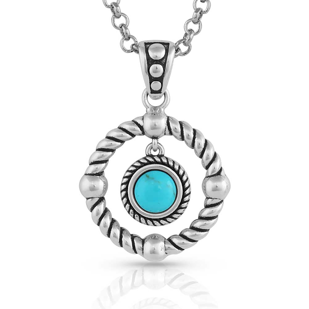 A silver-tone pendant featuring a round turquoise stone inside a twisted rope circle on a chain.