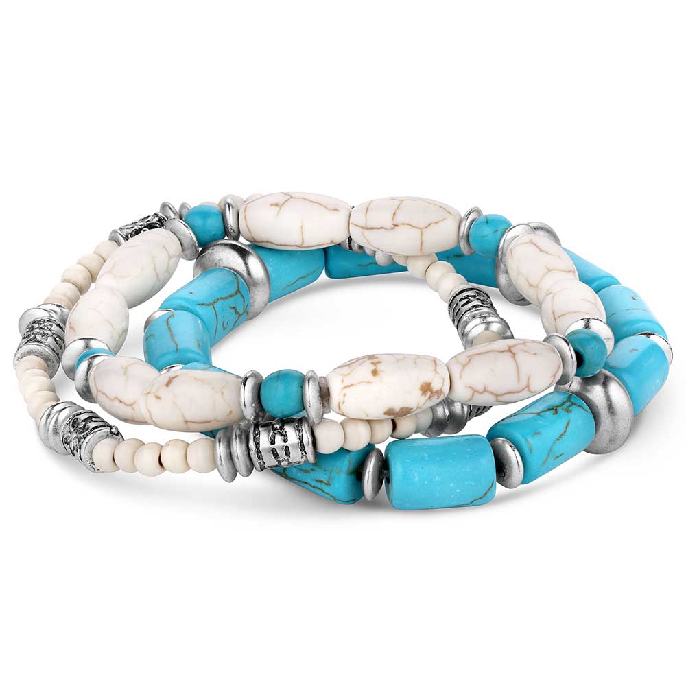 A set of three beaded bracelets featuring turquoise and white howlite stones with silver accents.